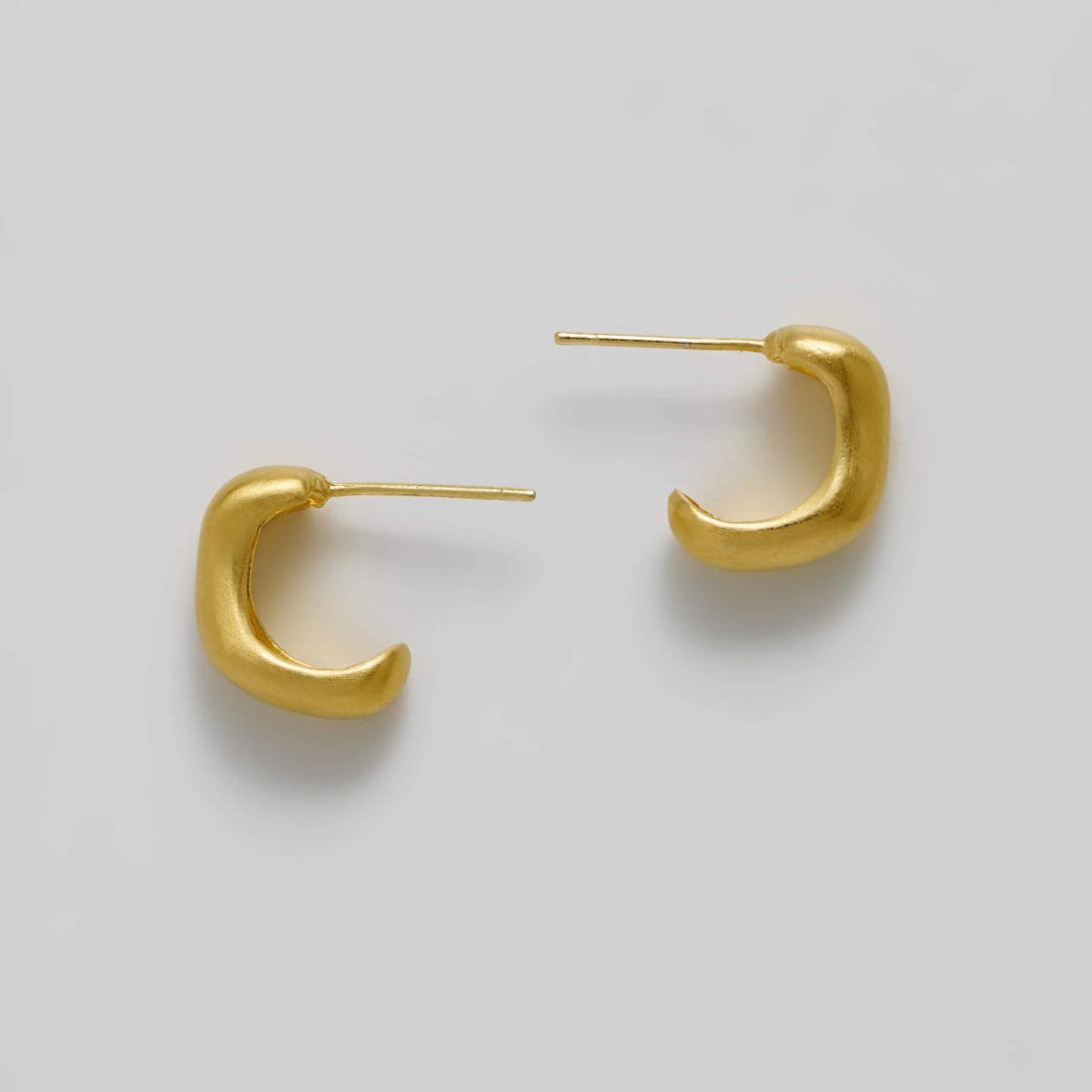 Gold Plot Twist Earrings by Xoutou's
